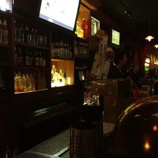 a bar with a large screen tv
