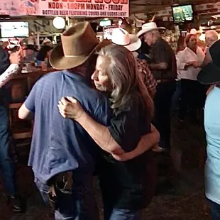 a man hugging a woman