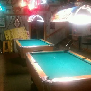 pool tables and neon signs