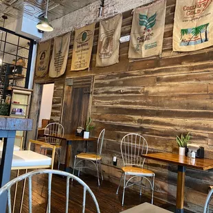 Front room seating; tables for two, high top bar