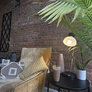 a couch and a table with a lamp on it