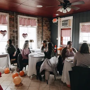 a group of people sitting around a table