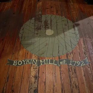 a wooden floor with a clock on it