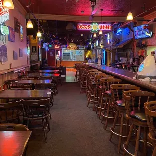 The long bar with music stage in the back.
