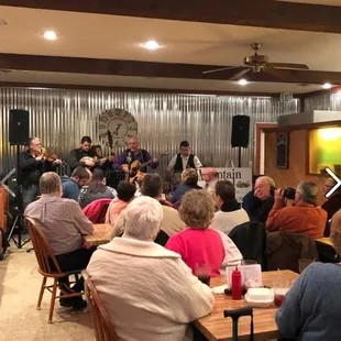 a large group of people sitting at tables