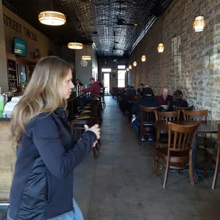a woman standing in a restaurant