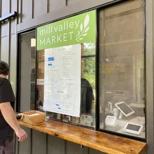 a man standing in front of a window