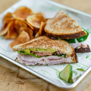 a sandwich and chips on a plate