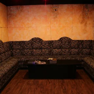 a zebra print couch and coffee table