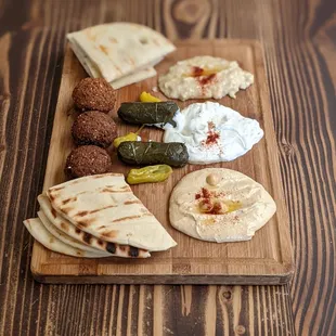 10/23/21 - Appetizer Combo Plate $14.95. Hummus, dolma x2, baba ganoush, falafel  x3, tzatziki. GOOD.
