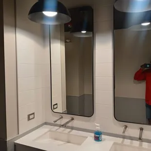  man taking a picture of himself in the mirror