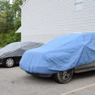 THIS IS WHAT A NEW MILLENNIUM DID NOT DO...COVERED THE CARS TO PREVENT DAMAGE