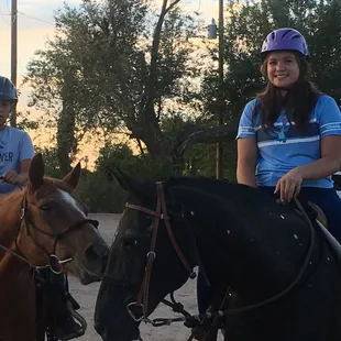 Two other grand kids, smiling big, after their trail ride.