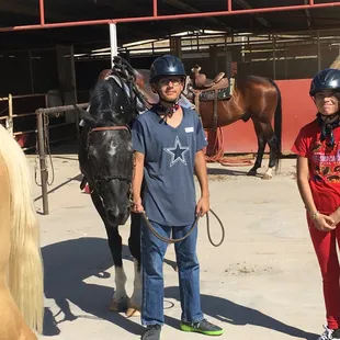 During our summer program for kids, campers learn to saddle their horses as well as ride each day.