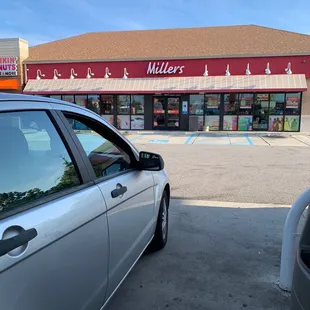 a car parked in front of the store