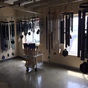 a display of bells hanging from the ceiling