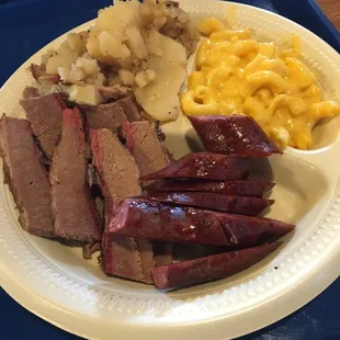 Two meat plate brisket and spicy sausage. Mac and German potato salad