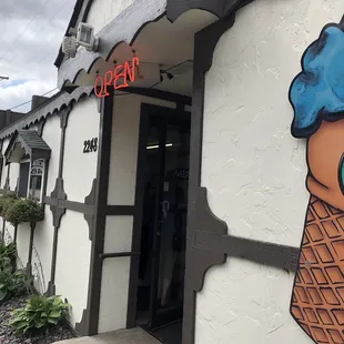an ice cream cone painted on the side of a building