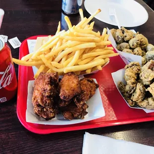 a tray of fried chicken and french fries