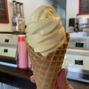 Vanilla soft serve in a waffle cone