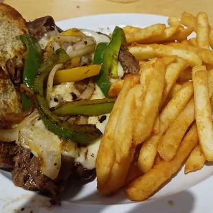 Philly Cheesesteak Sandwich with steak fries, served hot!