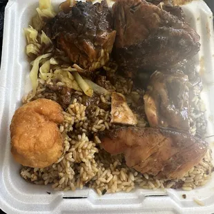 Large jerk chicken with rice and cabbage and jerk sauce. Really good without being overwhelmed by spice.