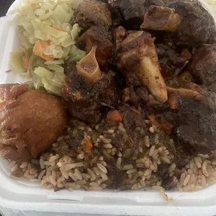 SM oxtails with cabbage and rice n peas with a SM Miller's Tropical Punch
