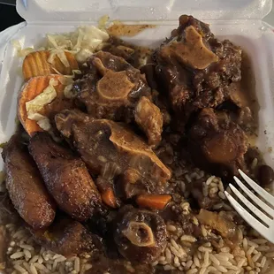 Oxtails, cabbage, plantains, with peas and rice.