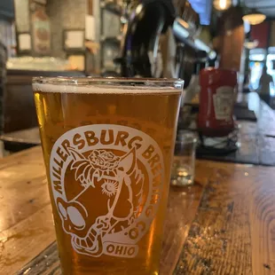 a pint of beer on a table
