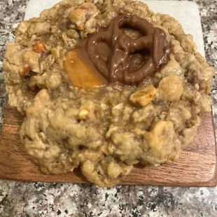 All Dat cookie is a Oatmeal chocolate chip cookie loaded with chocolate chips, caramel pieces, butterscotch pieces and pretzels.