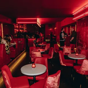 people sitting at tables in a restaurant