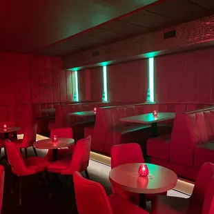 a restaurant with red and green lighting