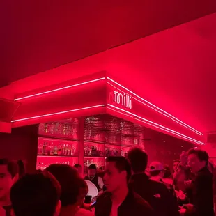 a crowd of people at a bar