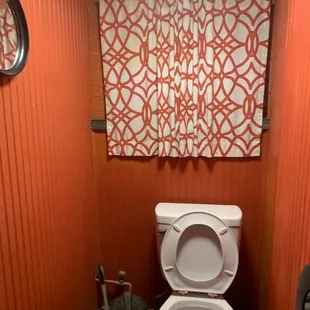 a toilet in a small bathroom