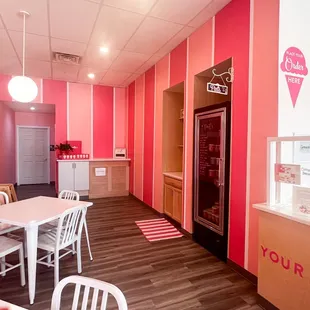 The bright and cheery inside of our South Fayette scoop shop. In this picture, you can see some of our seating area and our pint freezer.