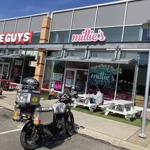 a motorcycle parked in front of a store