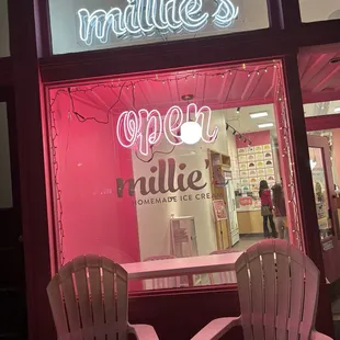 two chairs in front of the store