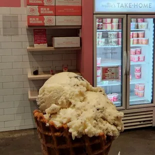 a hand holding an ice cream cone