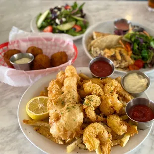 Perfectly fried Fried shrimp and cod, crab balls (tons of crab), and blackened mahi-mahi tacos with aioli sauce.