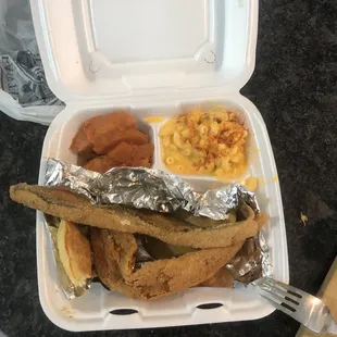 White fish with Mac and cheese and candied yams.