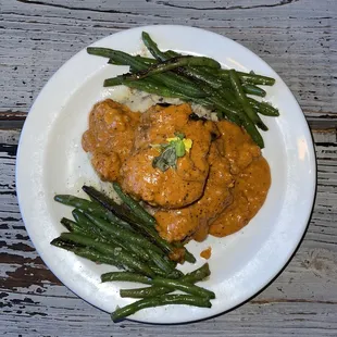 Florida Ranchers 7 oz. filet, local white shrimp, rustic mashed potatoes, blistered green beans, with a fondue