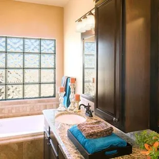 a bathroom with a tub and a sink