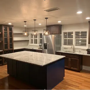 a large kitchen with a center island