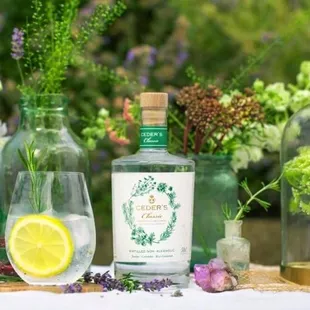 bottles of gin, lemon slices, and flowers