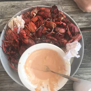 a plate of craws and sauce