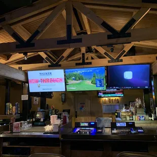 a bar with multiple screens