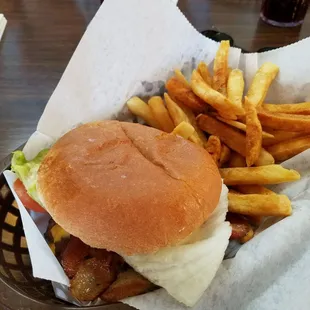 Double bacon cheeseburger with lettuce and tomato.
