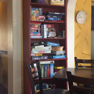 Board games set up around one of the rooms to enjoy while grabbing breakfast/lunch or grabbing a coffee drink