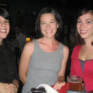 three women at a bar