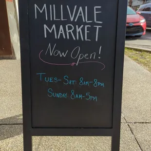 a blackboard sign with chalk writing